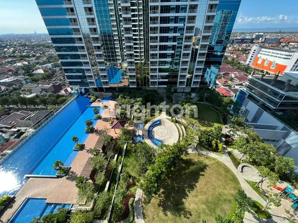 image APARTEMET ONE GALAXY SURABAYA VIEW KOLAM RENANG DAN CITY (1)