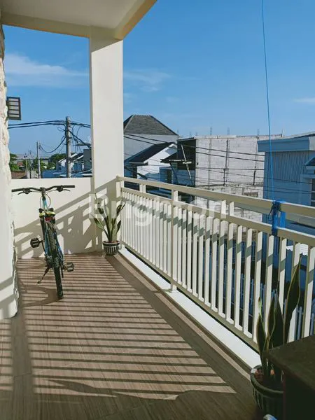 image RUMAH MINIMALIS DENGAN BALKON DEPAN DI EVERGREEN SURABAYA TIMUR  (1)