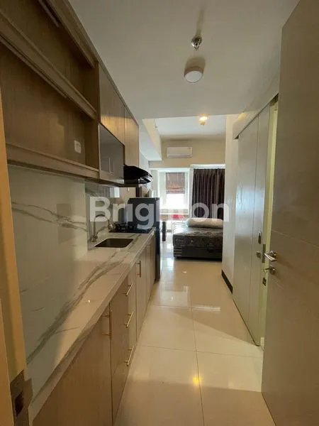 image APARTEMEN AMOR STUDIO FULL FURNISH BARU GRESS (1)