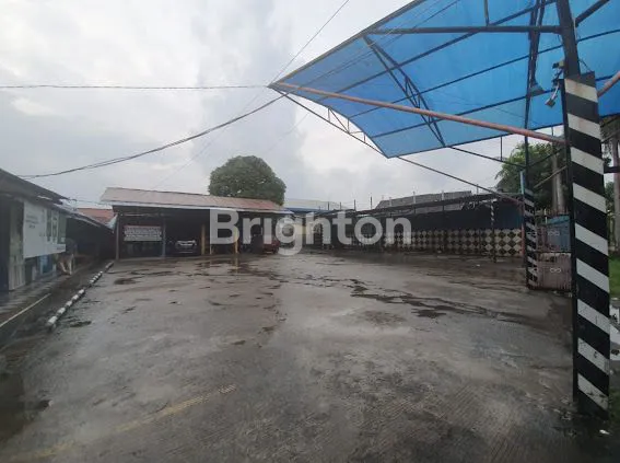 TANAH PLUS GUDANG BESAR JALAN RAYA STRATEGIS